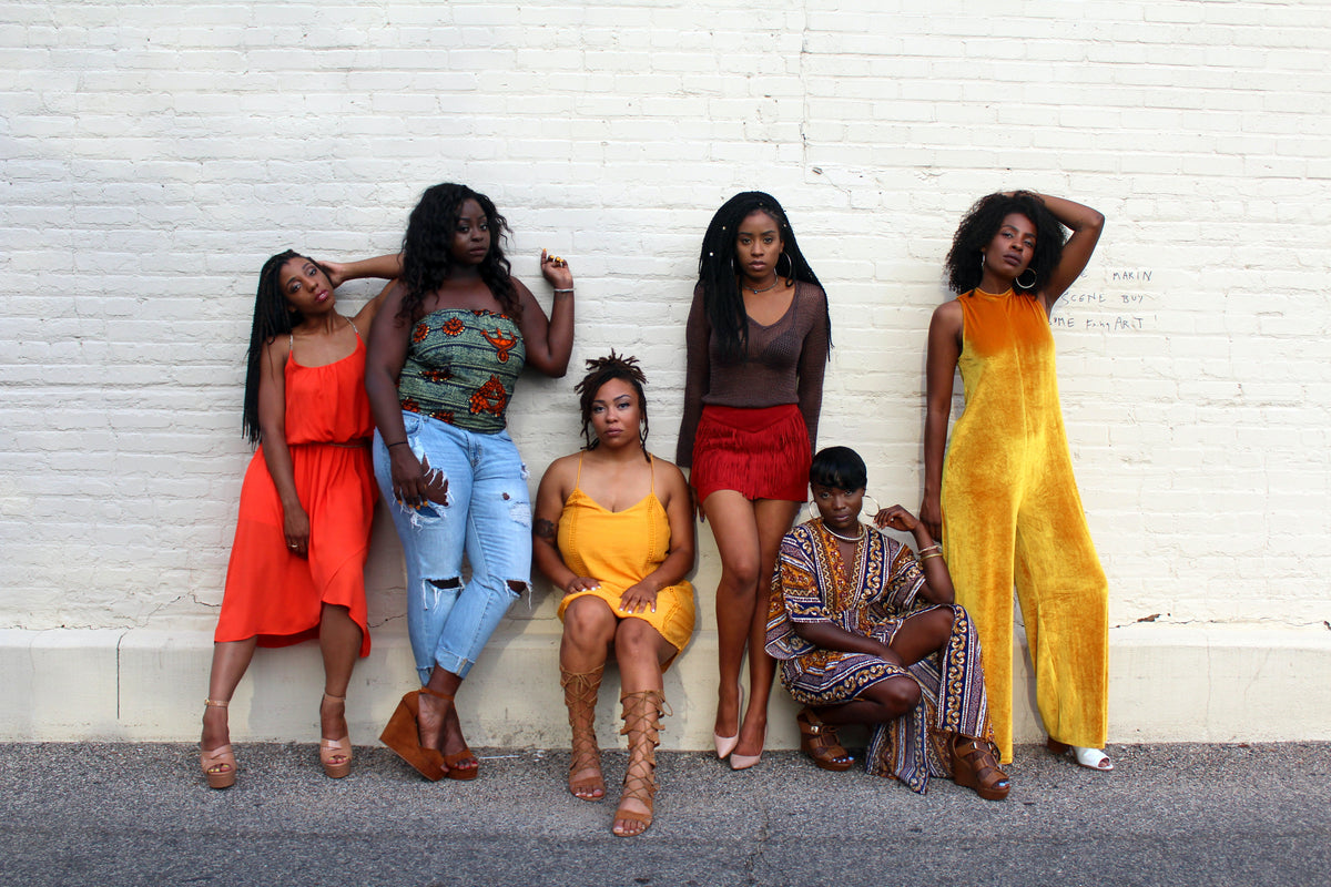 Black ladies posing in the background Fashion for Different Cultures